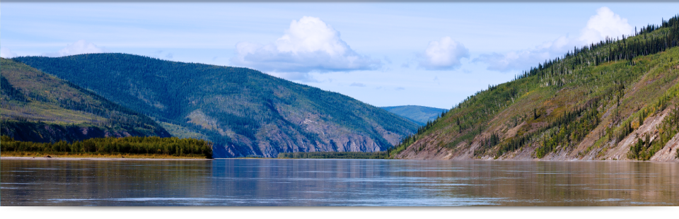 mountain backdrop behind a lake | lawyer in Whitehorse, Yukon